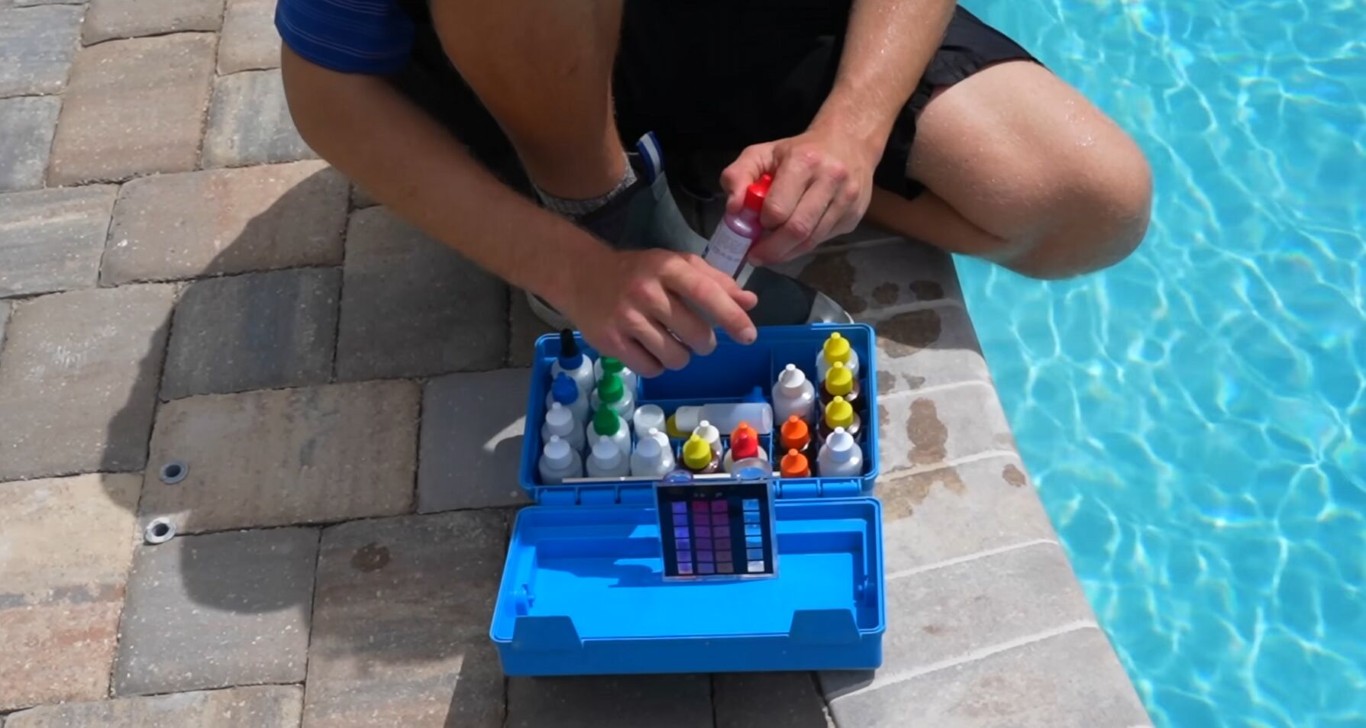 Pool technician testing water chemistry for optimal pool balance in Union City, CA